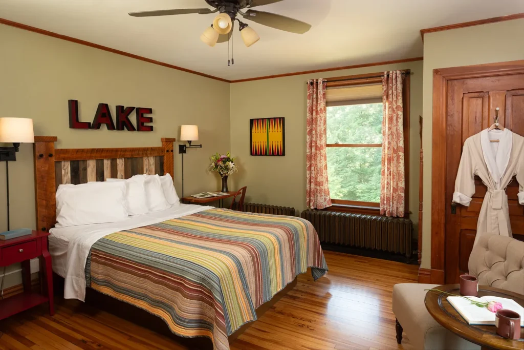 Elisha’s Room: striped quilt, lake sign and window seat
