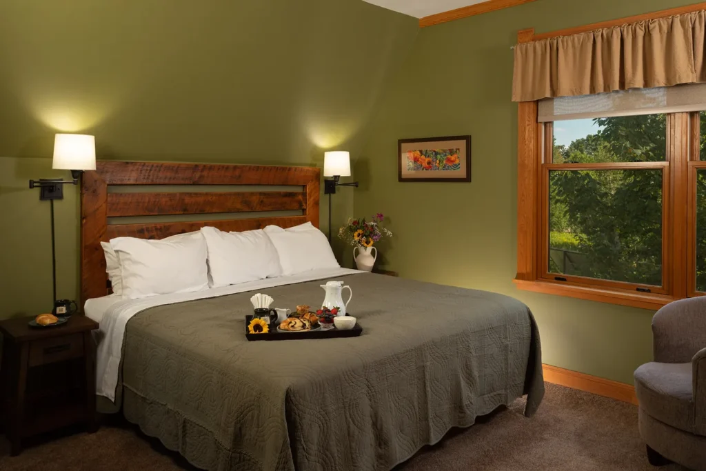 Whispering Pines: king bed with breakfast tray and garden view